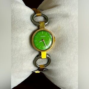 TISSOT women's mechanical manual winding watch gold plated green dial.